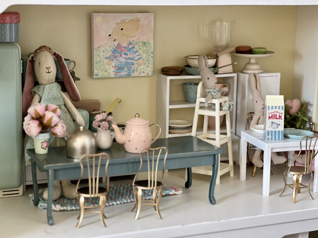 spring art and flowers in dollhouse