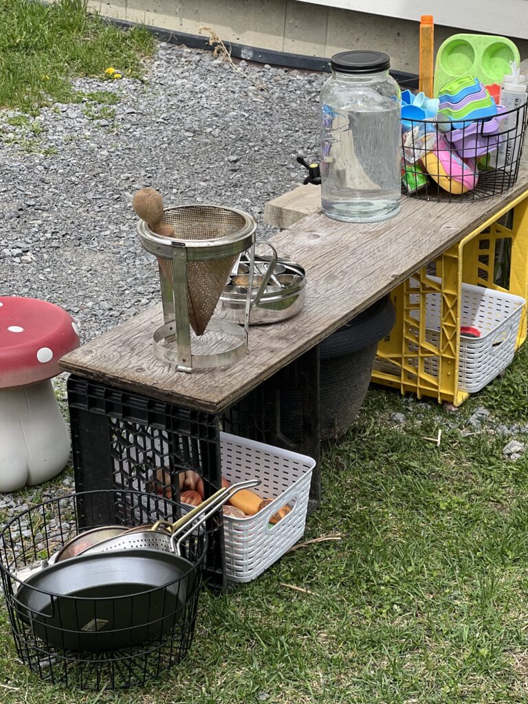 mud kitchen with milk crates