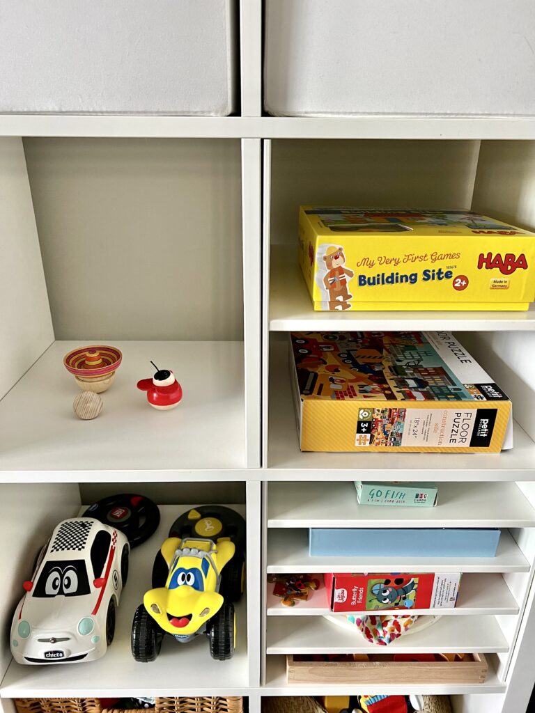 toys and puzzles on Kallax shelf