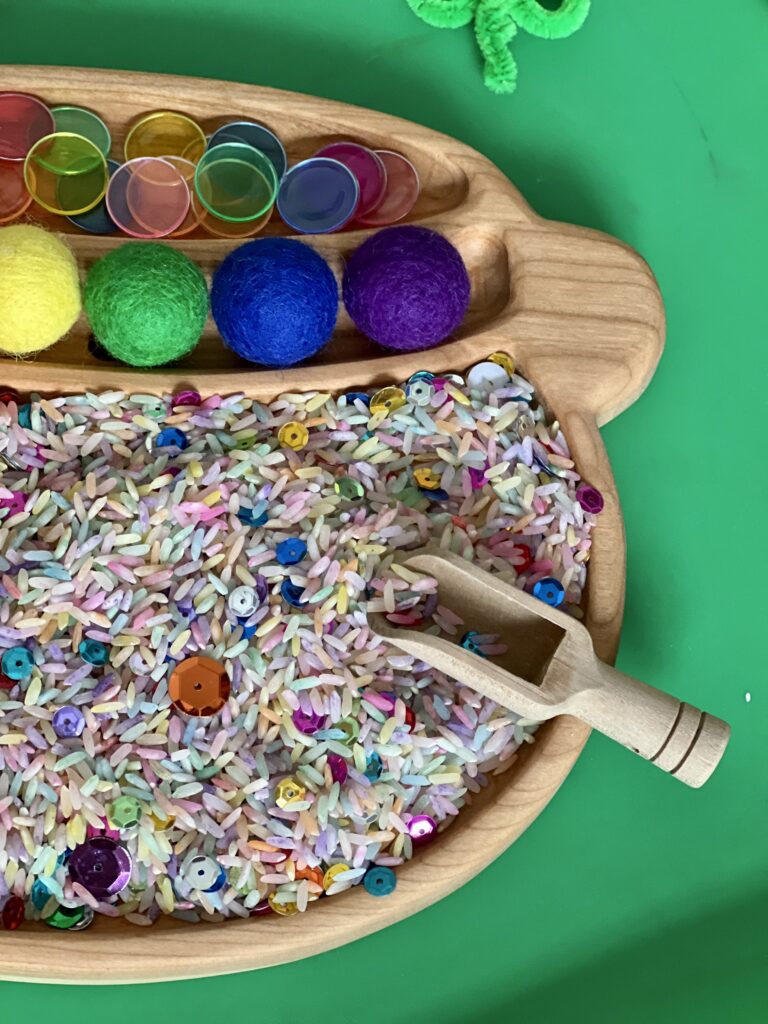 wood cauldron tray with rice, felt balls and magnetic bingo chips