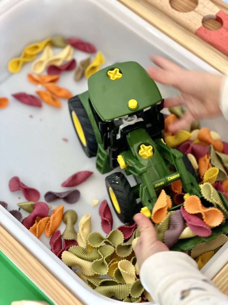 toy tractor scooping pasta