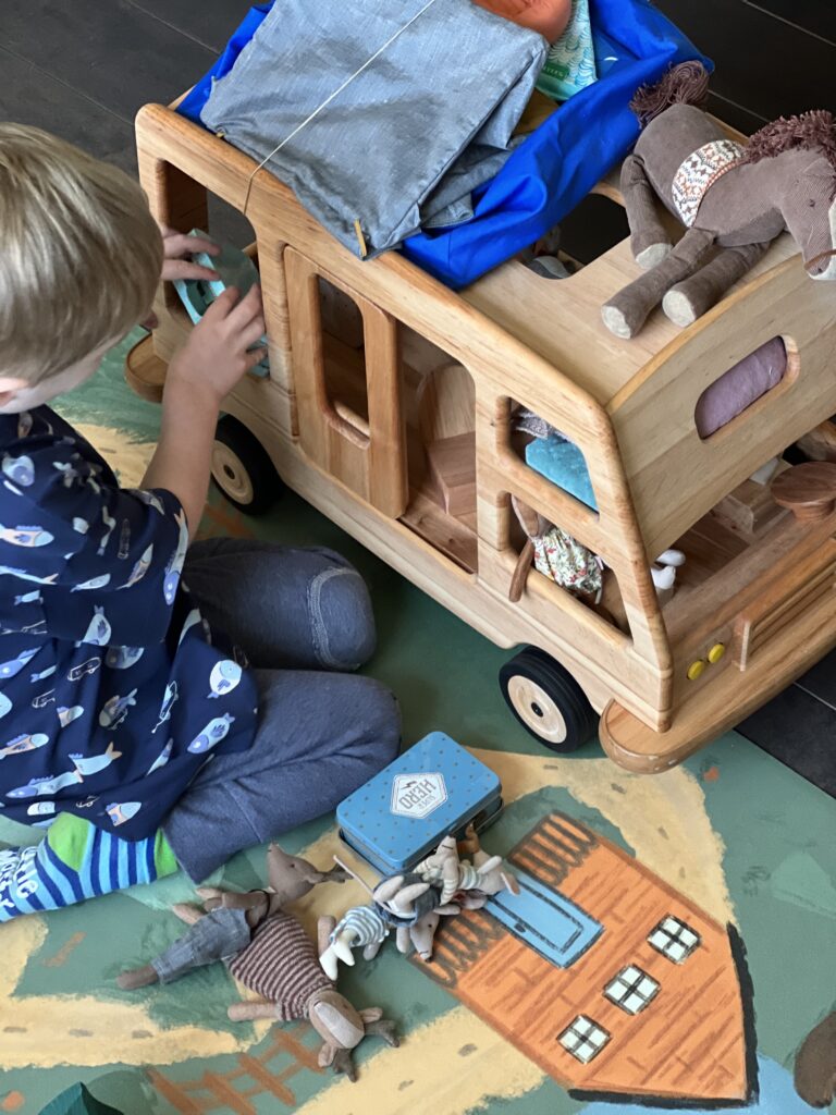 boy unpacking stewart camper van