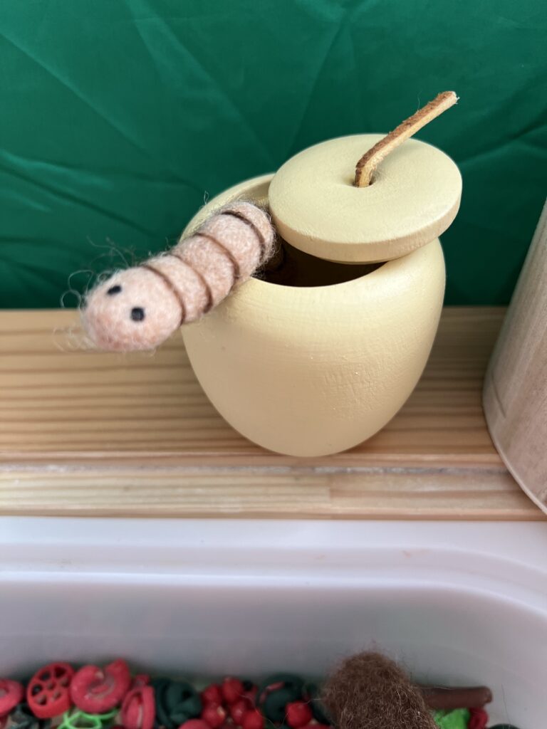 felt worm in apple wood container